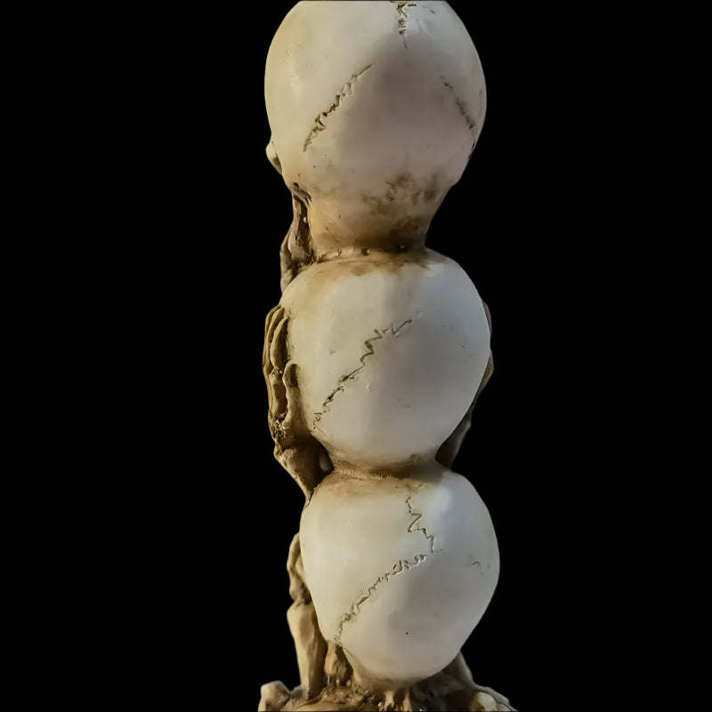 Skulls of the Unspoken Law Statue