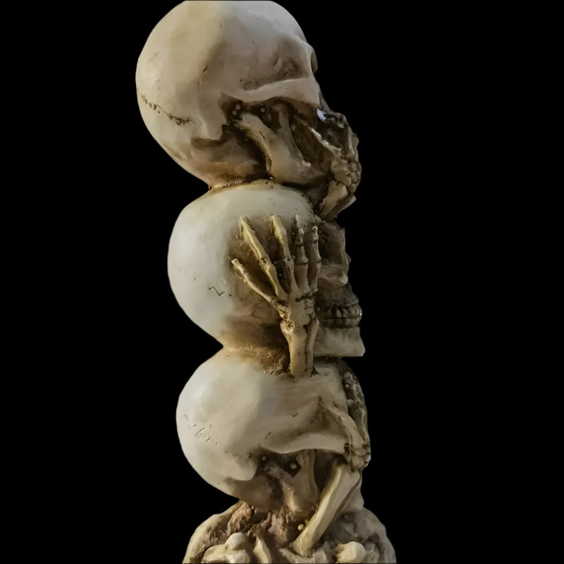Skulls of the Unspoken Law Statue