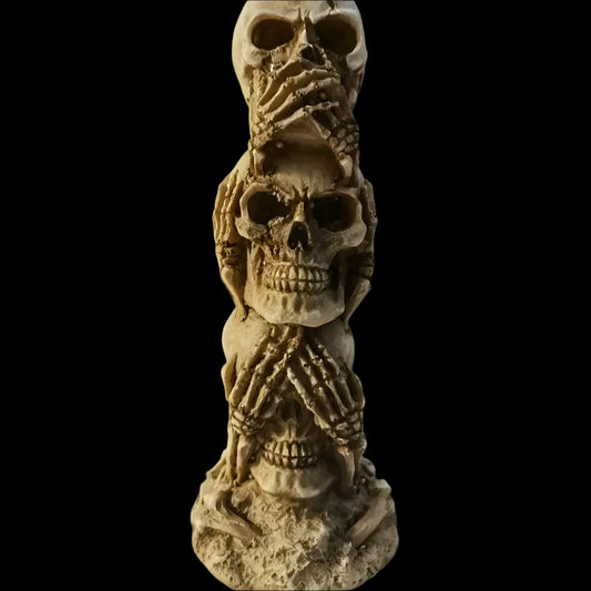 Skulls of the Unspoken Law Statue