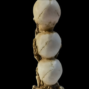 Skulls of the Unspoken Law Statue