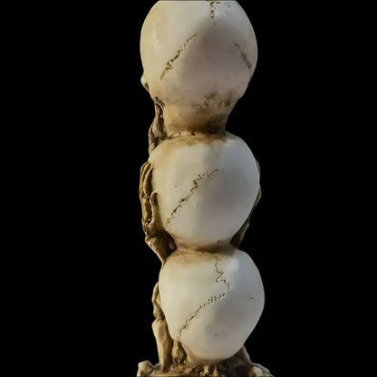 Skulls of the Unspoken Law Statue