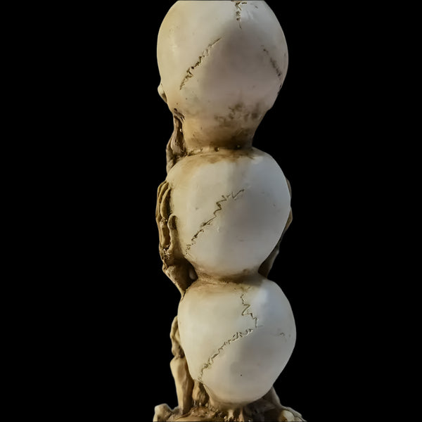 Skulls of the Unspoken Law Statue